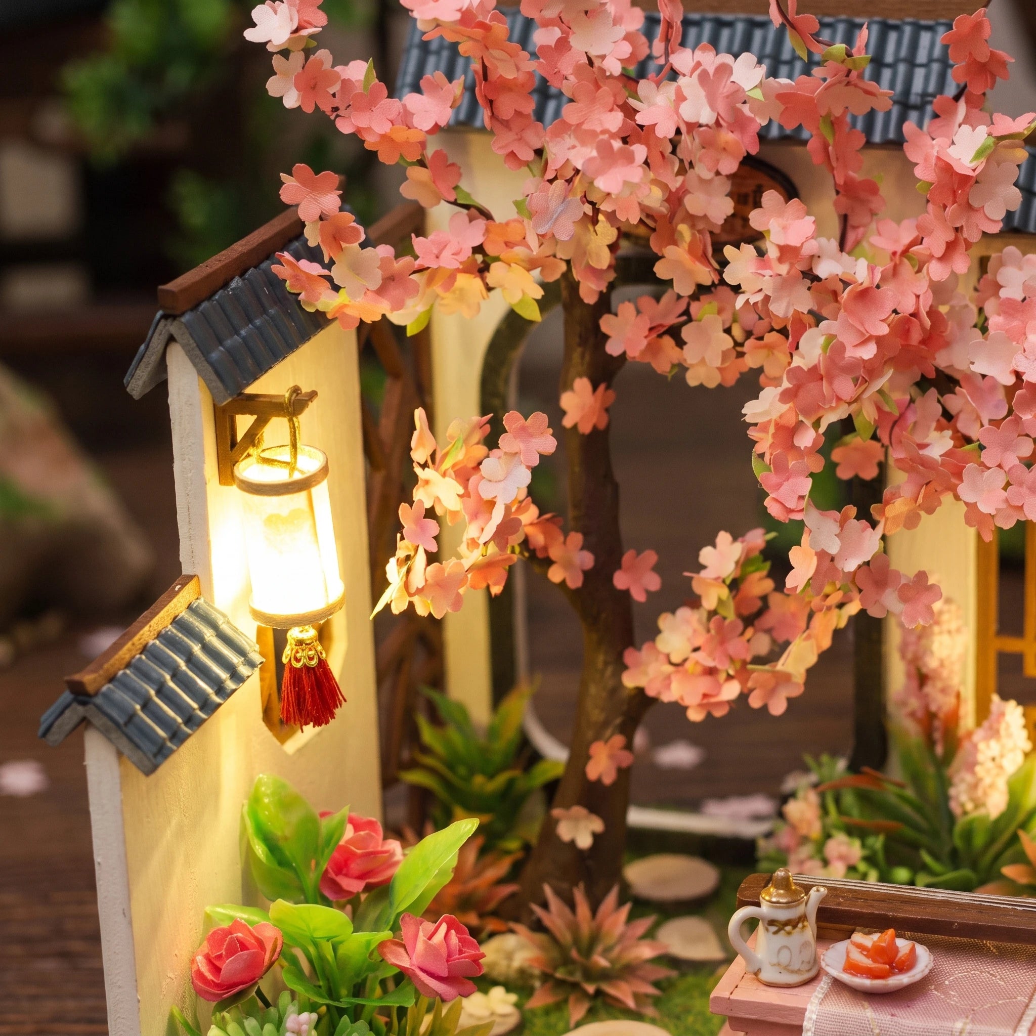 Blossom canopy and wall lamp detail over the courtyard wall
