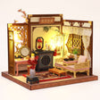 The Poet's Chamber DIY miniature roombox kit, assembled with LED lights on