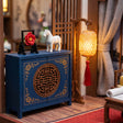 Blue moon cabinet detail with white horse and woven lantern
