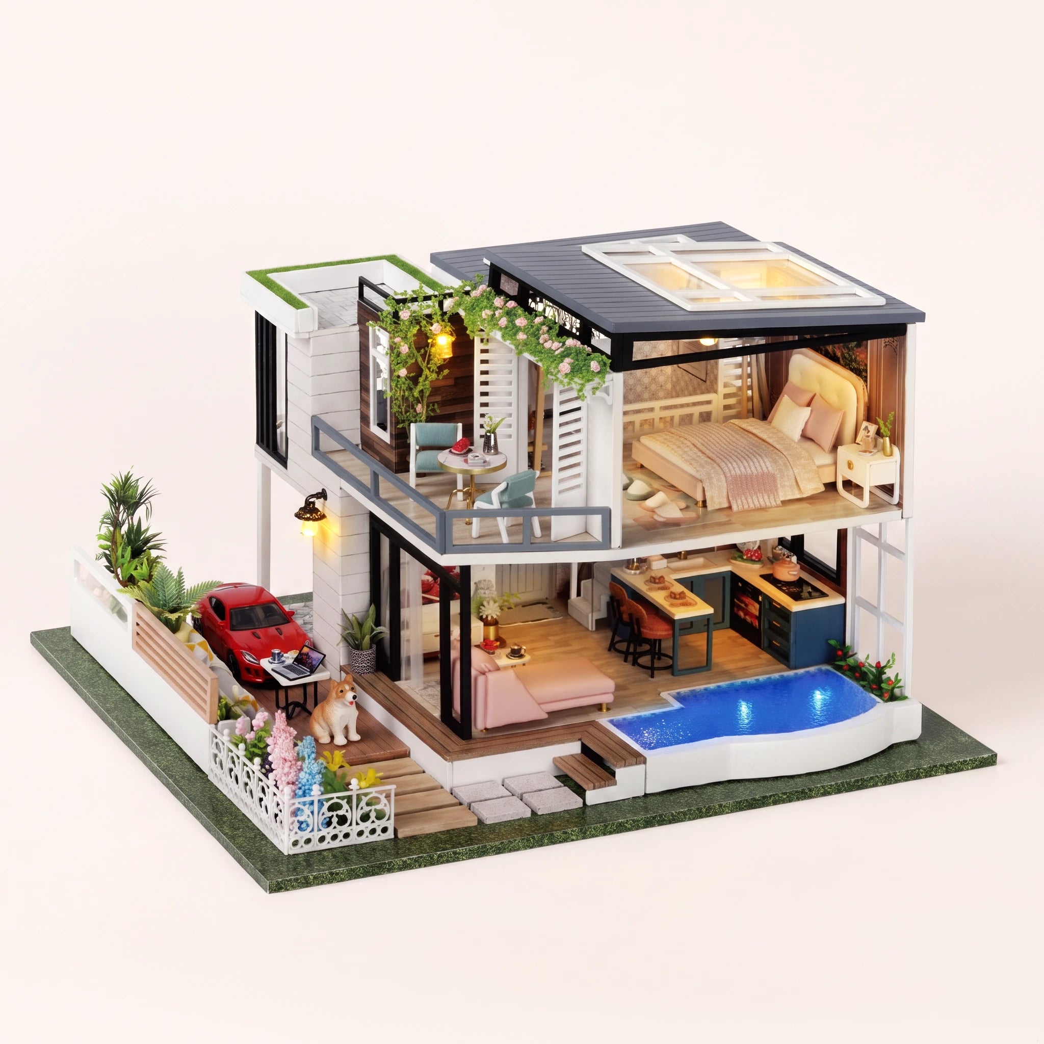 The Poolside Villa DIY miniature kit, LED lit with glowing pool, on a pale blush studio background