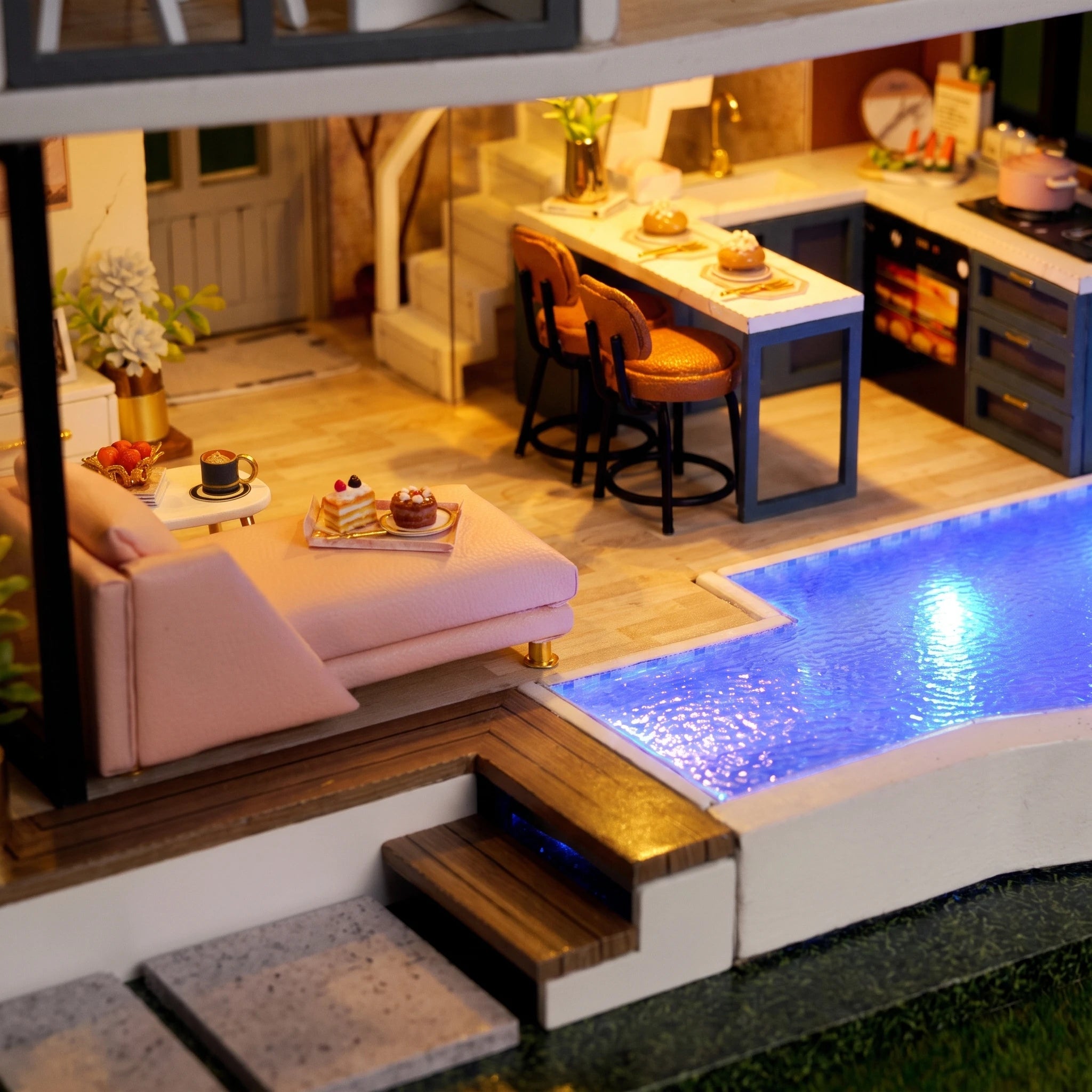 Macro of the glowing pool, pink lounge and cake tray