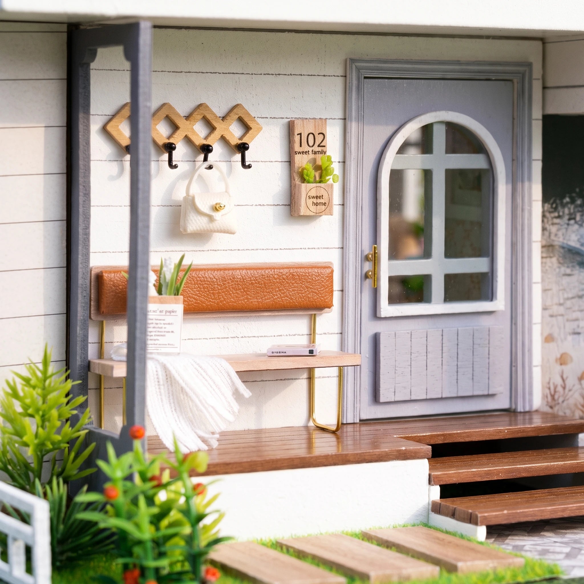 Macro of the entry porch with the 102 door and bench