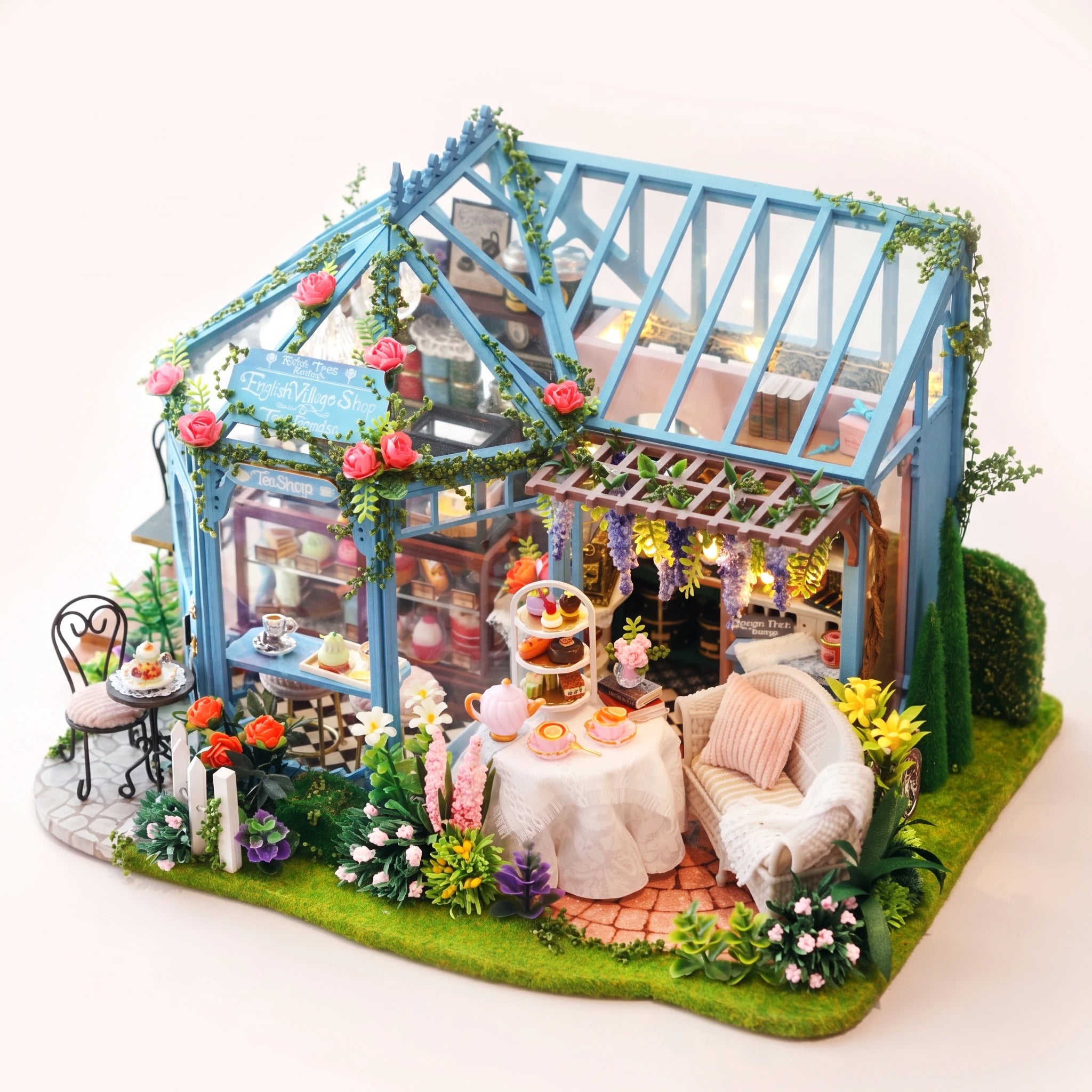 The Rose Glasshouse DIY miniature tea house kit, assembled with LED lights on