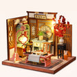 The Scholar's Study DIY miniature roombox kit, assembled with LED lights on