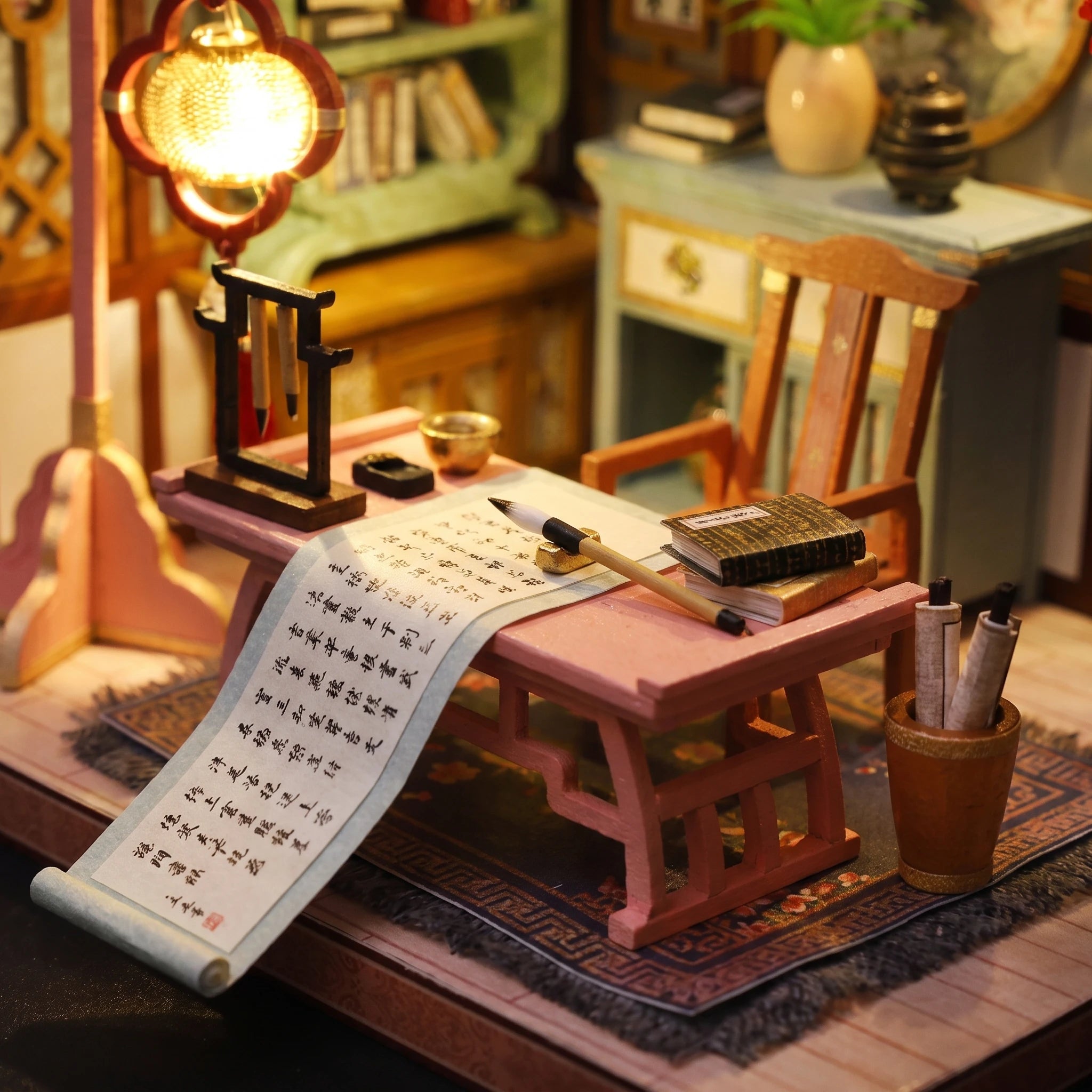 Writing desk detail: unrolled scroll, brush and ink stone