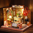 The Scholar's Study glowing on a walnut shelf at night