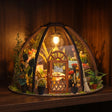 The Seedling Dome glowing on a dark walnut shelf at night