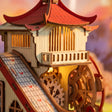 Macro of the red pagoda cabin and fish chute glowing warm