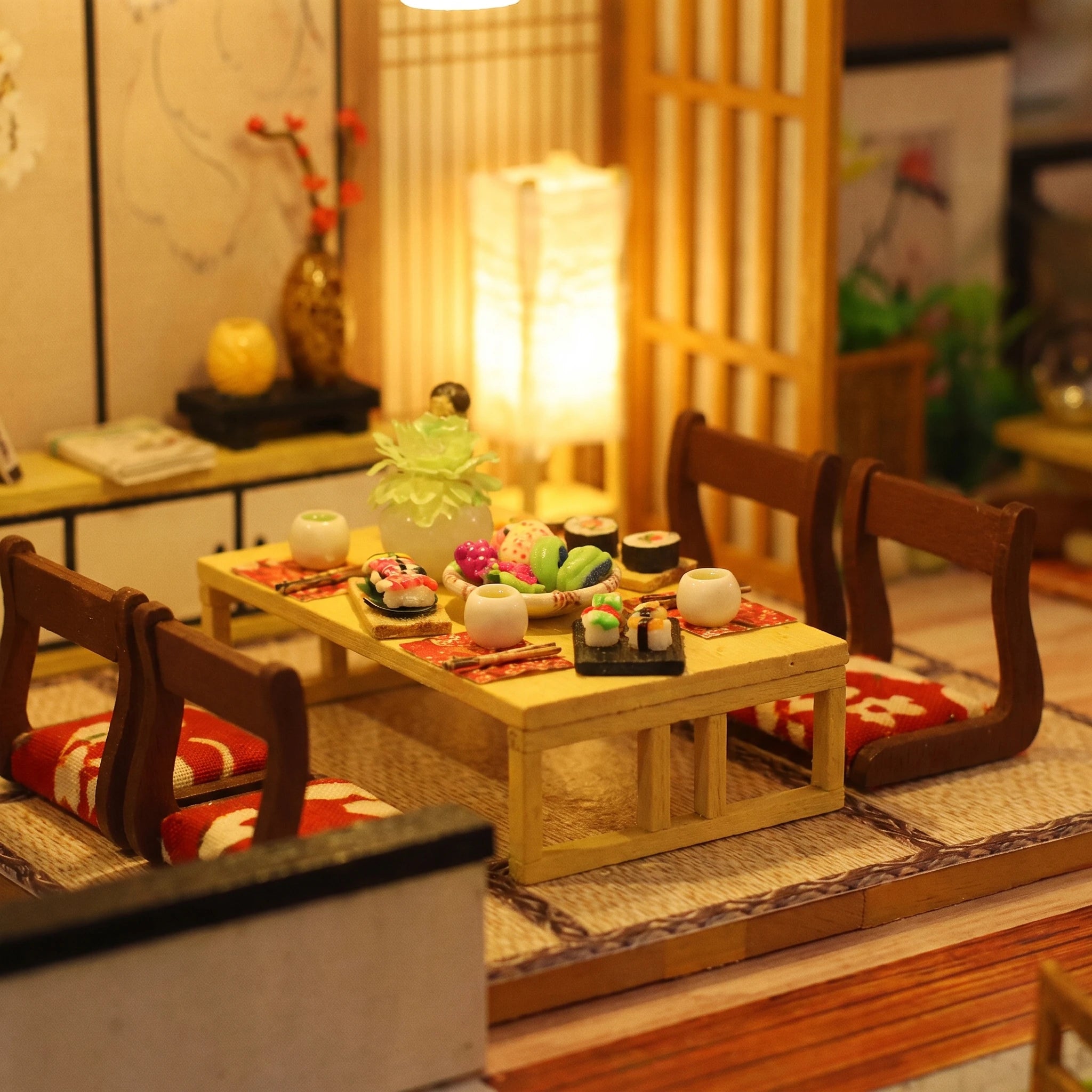 Macro of the low dining table set with dinner and red cushions
