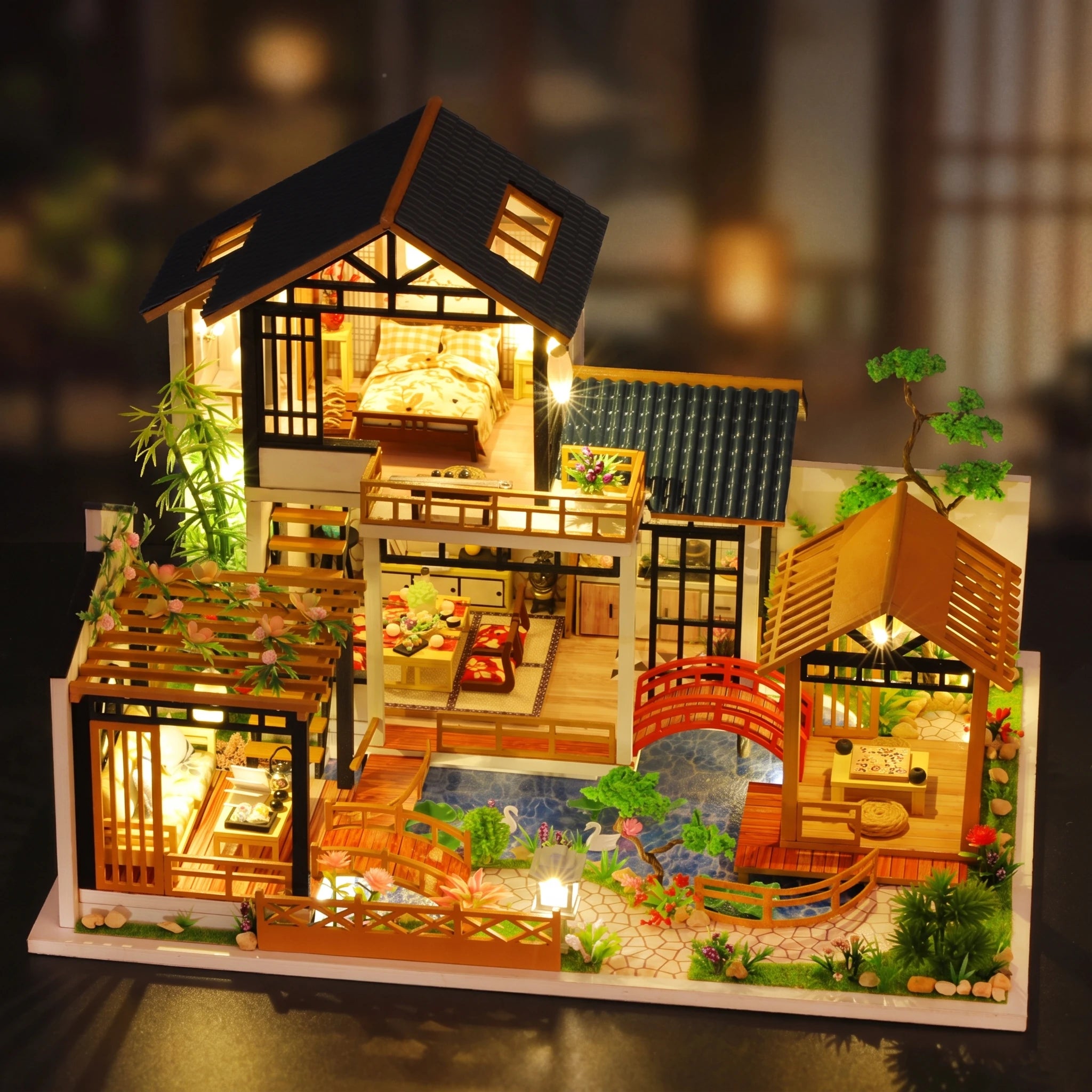 The Swan Garden villa glowing at dusk, angled view