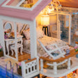 Detail of the upstairs bedroom with lace bed and dressing table