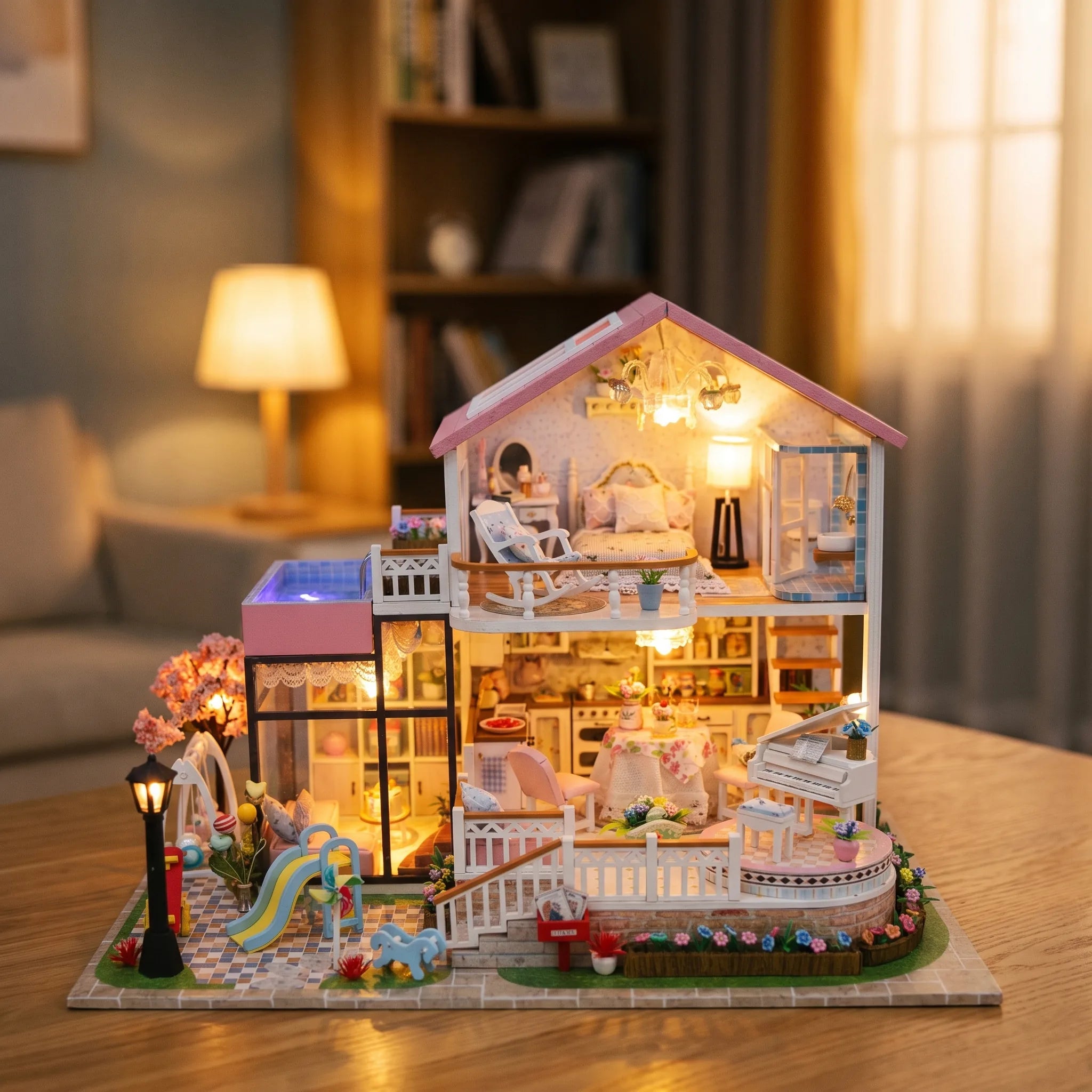 The Sweetheart Villa lit up on a wooden table in a cozy living room
