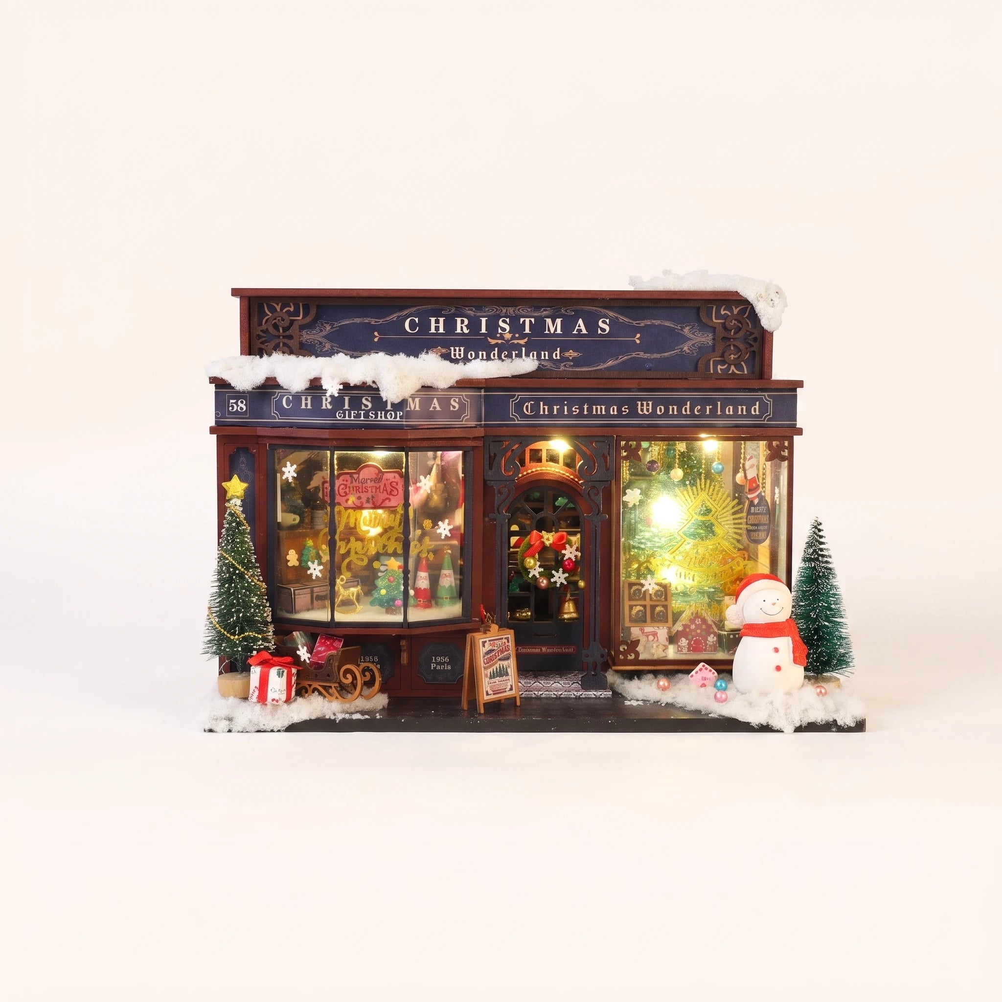 The Tinsel Emporium DIY miniature Christmas shop kit, assembled with LED lights on