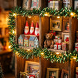 Gift shelf detail with santa cones, teddy bear and presents