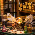 Detail of the shop counter with crystal ball, owl and potion bottles inside The Wandmaker's Atelier