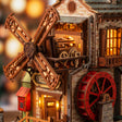 Macro of the windmill, gears and red waterwheel