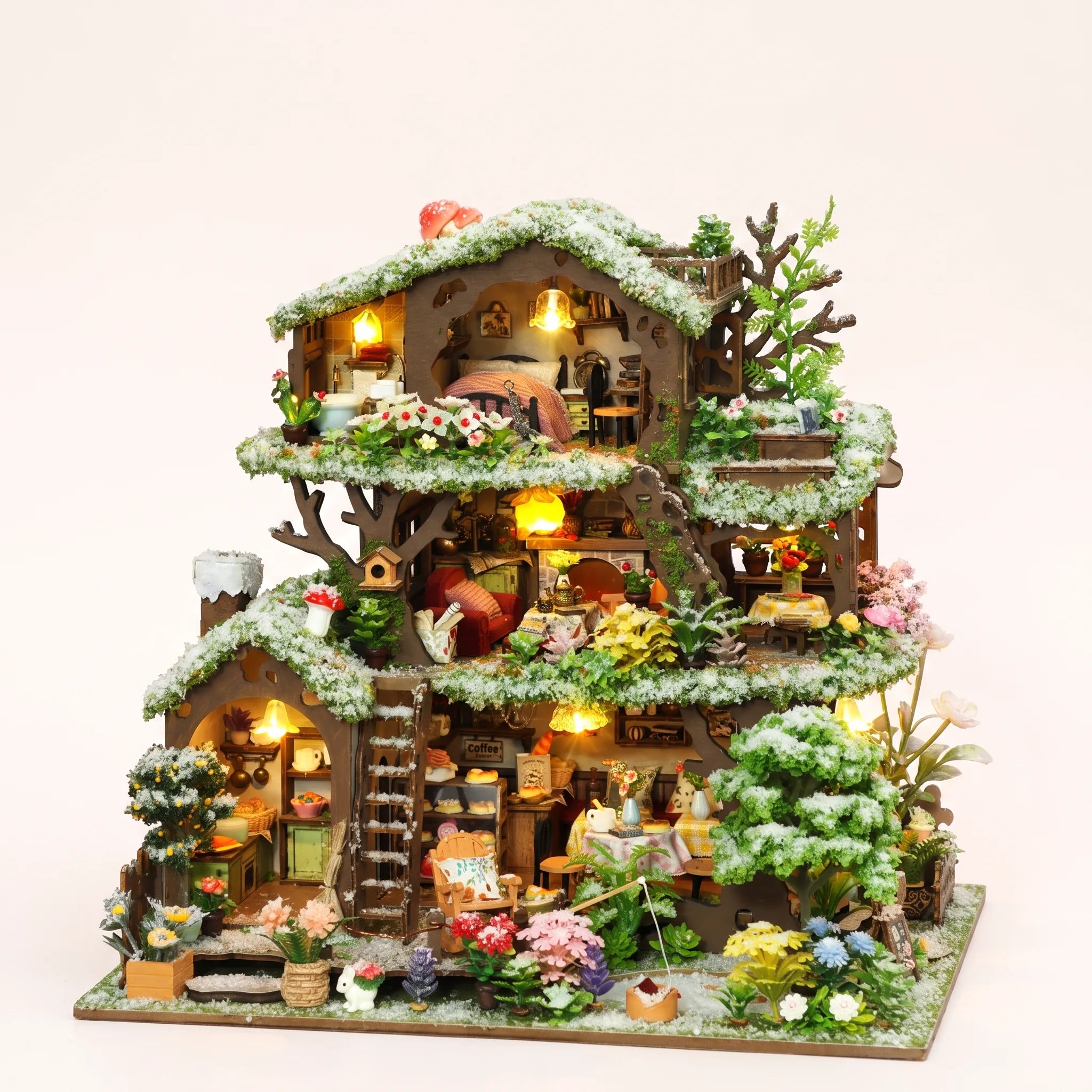 The Winterwood Treehouse DIY miniature kit with LED lights on, studio hero shot