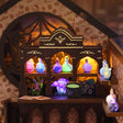 Close up of the glowing potion syrup shelf inside The Witch's Brew book nook