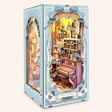 The Wonderland Keyhole DIY book nook kit, LED lights on, three-quarter view