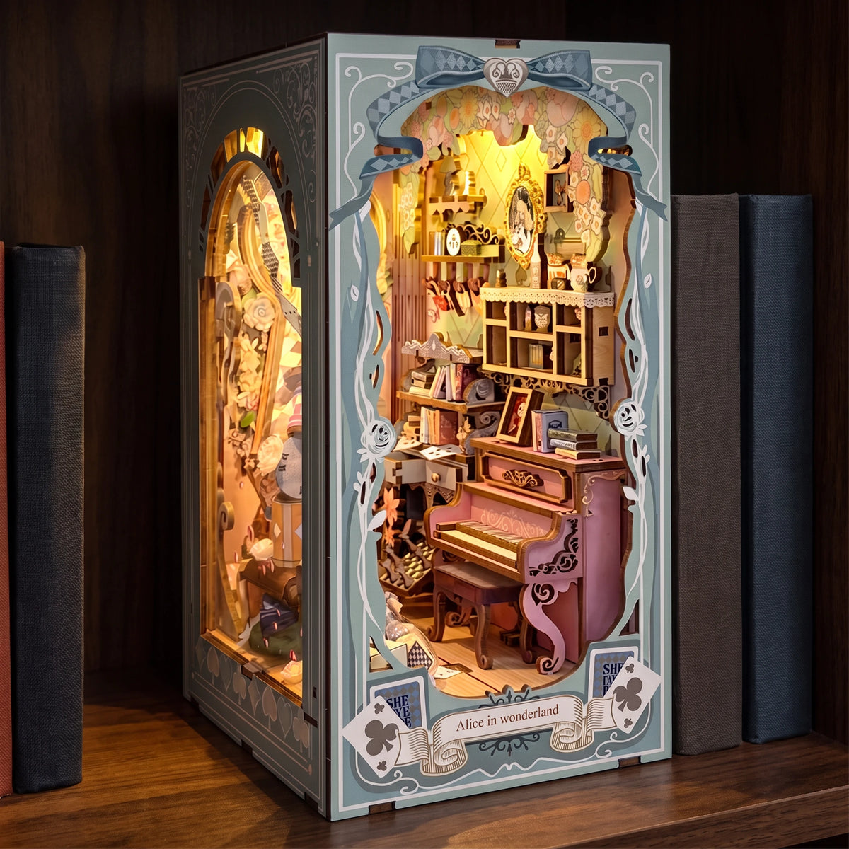 The Wonderland Keyhole glowing on a walnut shelf at night between books