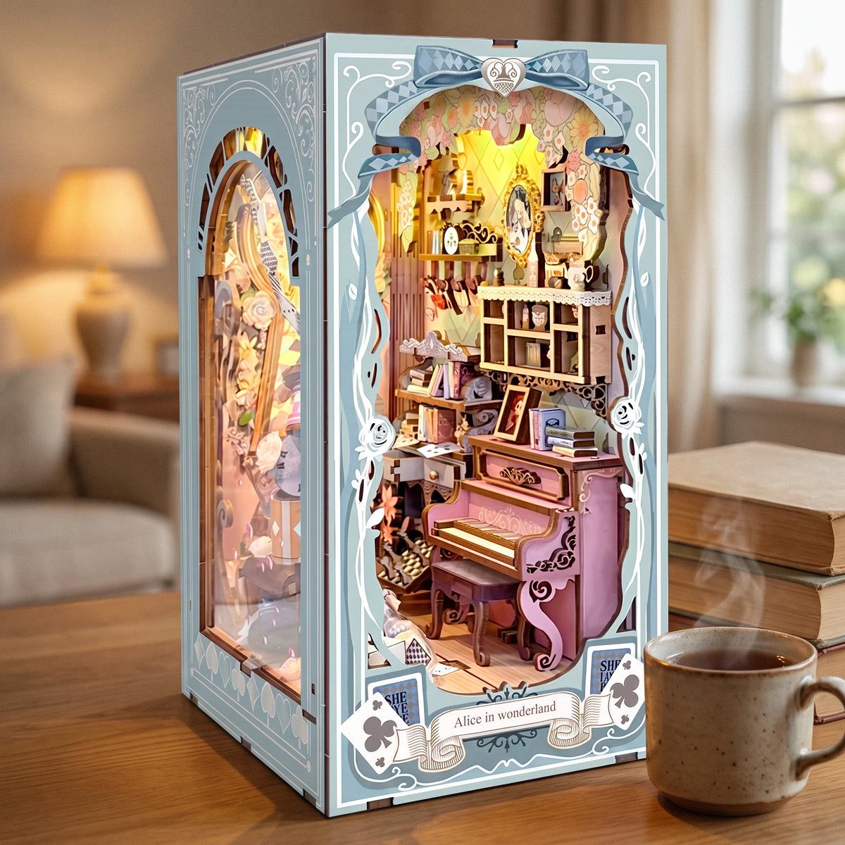 The Wonderland Keyhole lit up on a desk at dusk beside a mug of tea