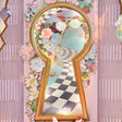 Macro of the gold keyhole and printed checkerboard path framed by paper roses