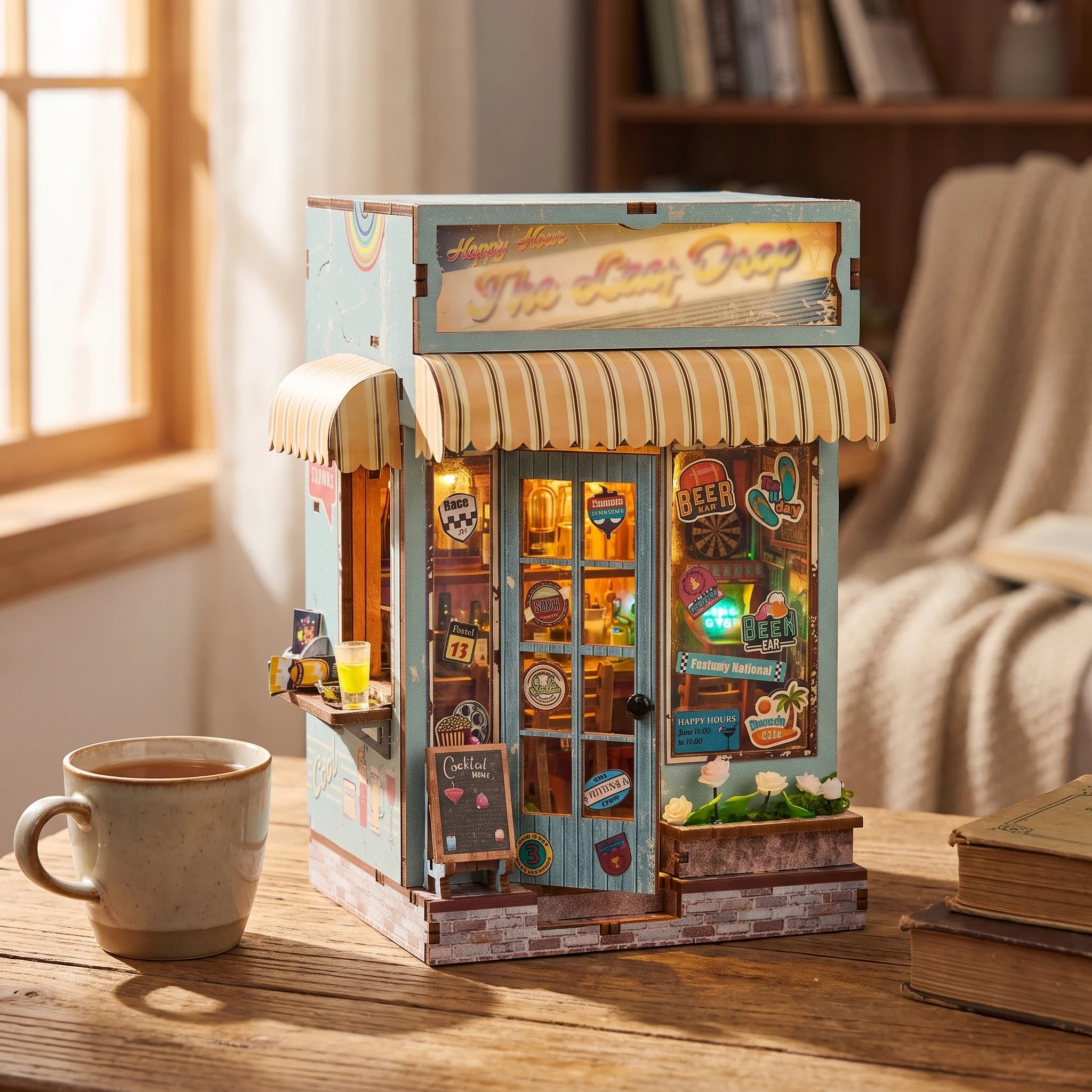 The Tiki Bar kiosk on a desk beside a mug of tea in soft window light