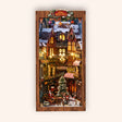 The Winter Lane DIY Christmas village book nook kit, lit, on a cream studio background