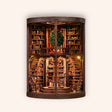 The Wisdom Rings Library miniature cylindrical library on a cream background