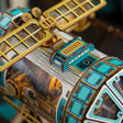 Hull detail: gold lattice truss and lit porthole rows